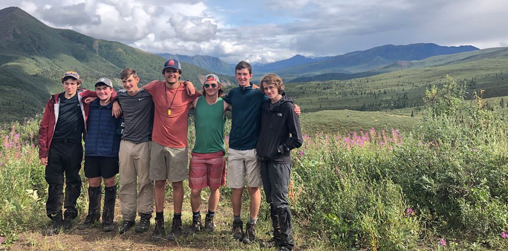 teenage boys hiking in alaska